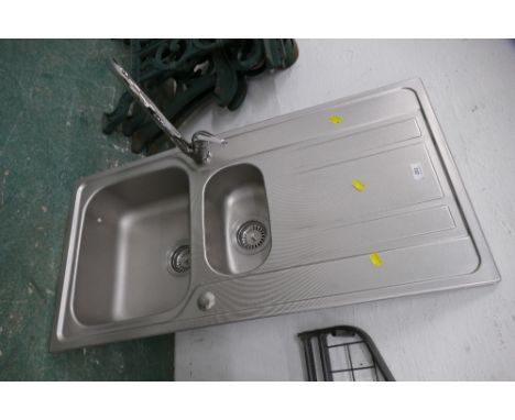 Kitchen sink with tap