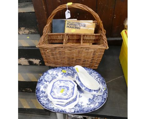 Blue and white ceramics, wicker wine hamper and two books