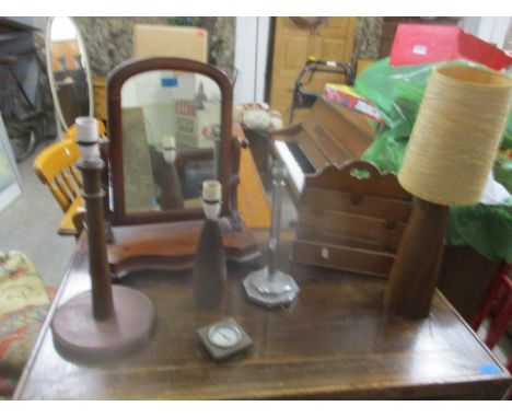 A Victorian mahogany serpentine fronted swing mirror, mahogany stationary rack, an Art Deco chrome table lamp, two teak mid-c