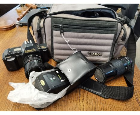 A Canon T70 camera and accessories all contained in a travel bag. Location:1:1 