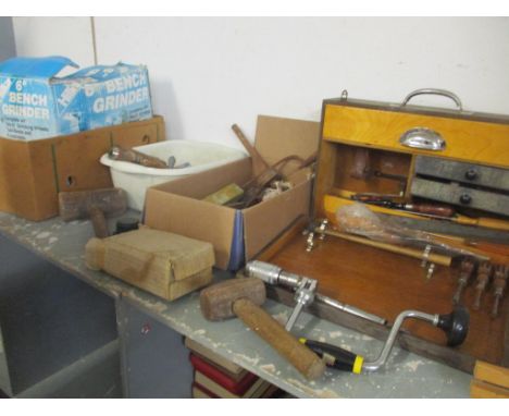 Vintage hand tools to include mallets and bench grinder, a toolbox, plane, drills and other items 