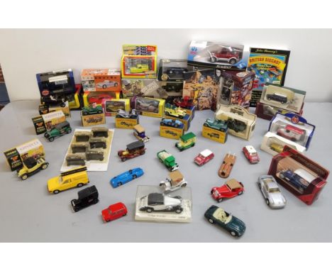 A mixed lot of boxed Diecast model cars to include Matchbox models of Yesteryear, Corgi Classics, Post Office telephones, Onl