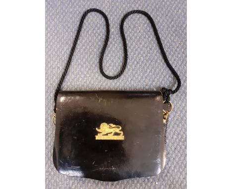 A vintage British Army Kings Own Infantry shot pouch in black leather having a Kings Own lion badge to the front, rings to th