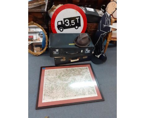 A vintage lot comprising two suitcases, a Dunn & Co brown felt hat, a circular metal road sign, a gold painted and plaster fr