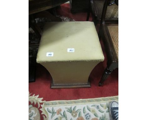 A MAHOGANY AND UPHOLSTERED STOOL the square seat above a tapering base above a mahogany platform with moulded beading on bun 