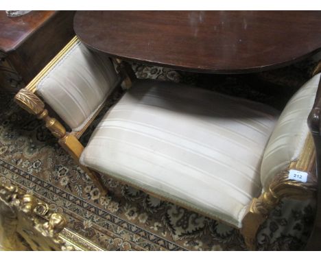 A CONTINENTAL GILTWOOD AND UPHOLSTERED STOOL with upholstered seat and back and acanthus leaf scroll uprights on reeded and r