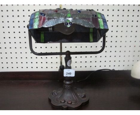 A TIFFANY STYLE DESK LAMP with coloured glass shade 31cm high