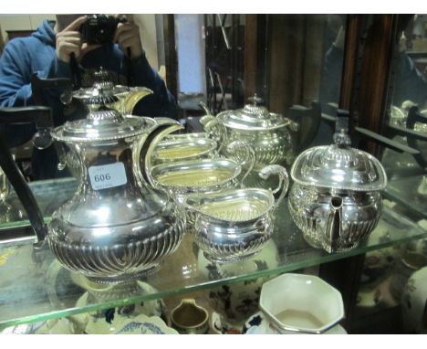 A FOUR PIECE SHEFFIELD PLATED TEA AND COFFEE SERVICE with gadrooned rim and ebonised handles