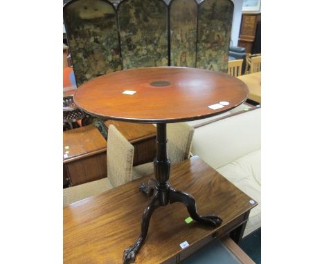 A MAHOGANY OCCASIONAL TABLE the circular dish top above a baluster column on tripod support with claw and ball feet 73cm (h) 