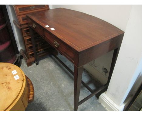 A GEORGIAN MAHOGANY SIDE TABLE of rectangular bowed outline the shaped moulded top with satinwood string inlay above two frie