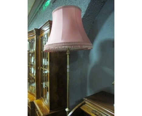 A VICTORIAN BRASS TELESCOPIC FLOOR STANDARD LAMP the cylindrical column raised on a pierced shaped platform with foliate and 