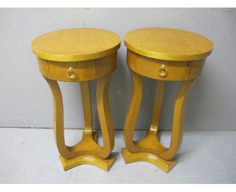 A PAIR OF ART DECO STYLE BURR WALNUT LAMP TABLES each of circular form with frieze drawer on shaped supports and concave plat