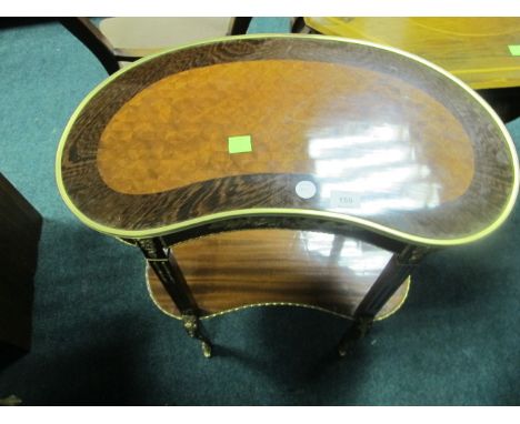 A CONTINENTAL KINGWOOD AND GILT BRASS MOUNTED OCCASIONAL TABLE of concave outline with frieze drawer raised on reeded taperin