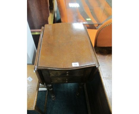 A WALNUT DROP LEAF TABLE of serpentine outline the shaped moulded top above a hinged cupboard raised on fluted and ring turne