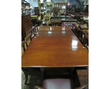 AN ELEVEN PIECE MAHOGANY DINING ROOM SUITE comprising ten Victorian mahogany dining chairs each with a curved top rail and sp