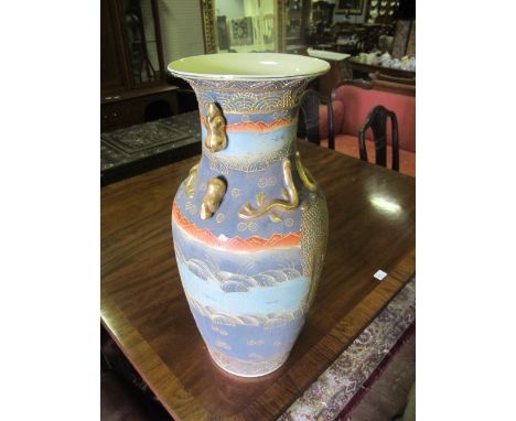 A PAIR OF SATSUMA VASES each of baluster form the light green, grey and gilt ground decorated with figures and stylized anima