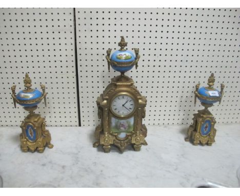 A FRENCH GILT BRASS AND PORCELAIN CLOCK GARNITURE 19th Century the rectangular arched case with enamel dial surmounted with a