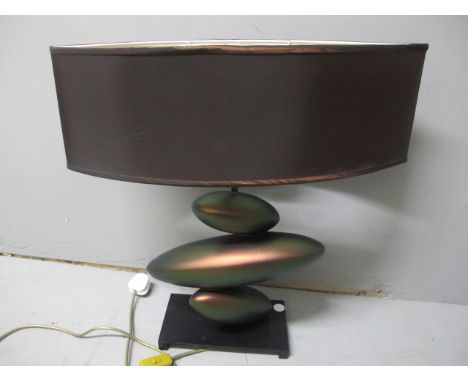 A DESIGNER LUSTRE TABLE LAMP of irregular form with oval shade raised on an ebonised metal base 61cm high