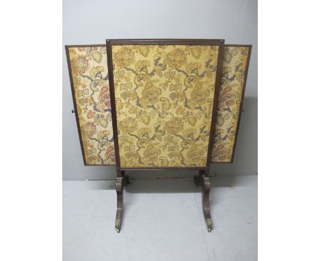 A GOOD GEORGIAN MAHOGANY FIRESCREEN the needlework panel within a reeded frame with side screens raised on standard end suppo