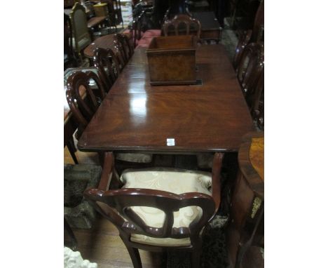 A FINE NINE PIECE MAHOGANY DINING ROOM SUITE comprising eight chairs including a pair of elbow chairs each with an arched top