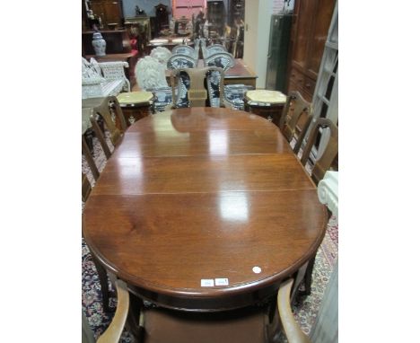 A MAHOGANY SEVEN PIECE DINING ROOM SUITE comprising six chairs including a pair of elbow chairs each with a verticle splat ab