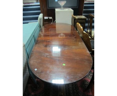 A REGENCY STYLE MAHOGANY D-END DINING TABLE of rectangular form with rounded ends and one loose leaf raised on twin tripod su