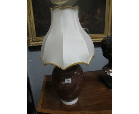 A PAIR OF ROUGE MARBLE TABLE LAMPS each of baluster form with shades 68cm high