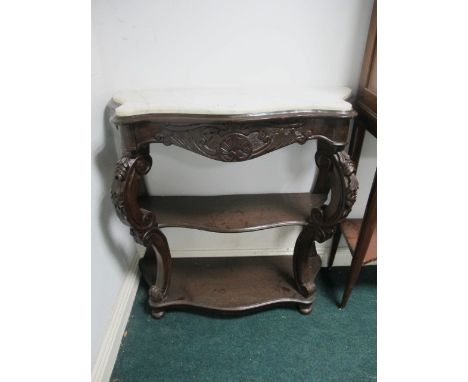 A CONTINENTAL MAHOGANY SIDE TABLE of serpentine outline surmounted with white vein marble top above two open shelves joined b