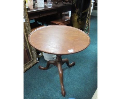 A GEORGIAN MAHOGANY OCCASIONAL TABLE the circular dish top above a baluster column on tripod support 61cm (h) x 60cm (d)