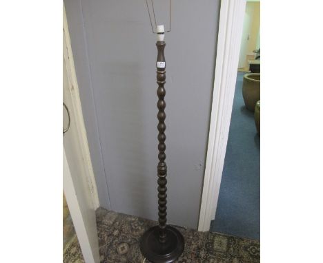 A MAHOGANY FLOOR STANDARD LAMP