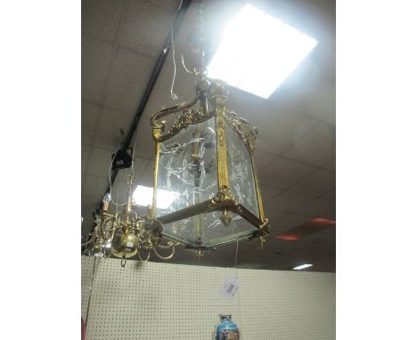 A GILT BRASS AND ENGRAVED GLASS SINGLE LIGHT HALL LANTERN the square frame with foliate and flower decoration containing etch