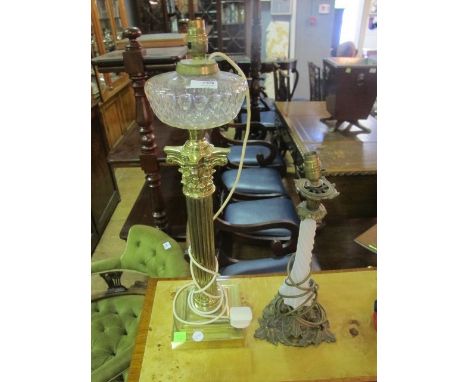 A VICTORIAN BRASS OIL LAMP converted together with a Victorian brass and opaline glass table lamp