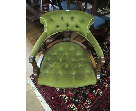 AN EDWARDIAN MAHOGANY TUB SHAPED CHAIR with button upholstered back and seat on cabriole legs