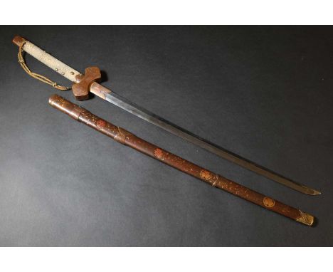 A Japanese katana, Edo or Meiji period, the lacquered scabbard with a gilt-flecked ground, decorated with mon, to floral scro