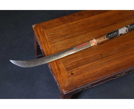 A Japanese naginata,Edo or Meiji, the blade with a red enamelled fuller, to a lacquered pole with copper mounts, and a black 