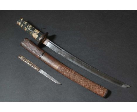 A Japanese wakizashi,Edo or Meiji, 19th century, the red lacquer saya (scabbard) with a kazuka, the mixed metal handle decora