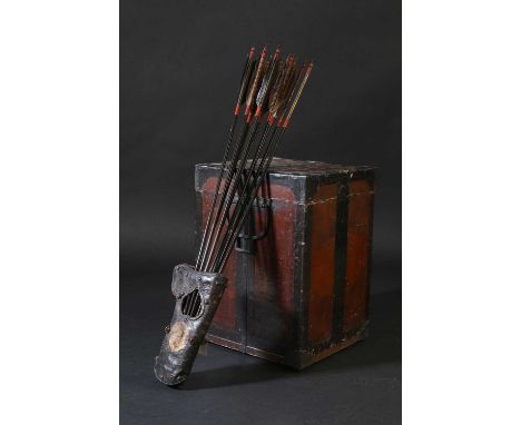 A Japanese leather arrow quiver,Edo or Meiji, the quiver painted with palmettes, a gilt mon and small round bosses, the woode