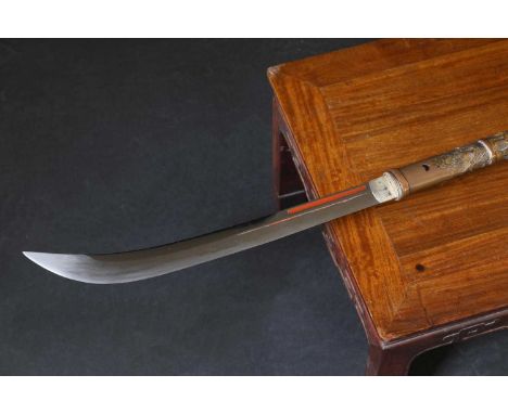 A Japanese naginata, Edo or Meiji period, the blade with twin fullers, tang signed, the top section of tsuka with mother-of-p