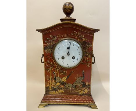 An early 20th century Japanned red and gilded mantle clock, decorated with cranes among a floral design, the 4" inch enamel d