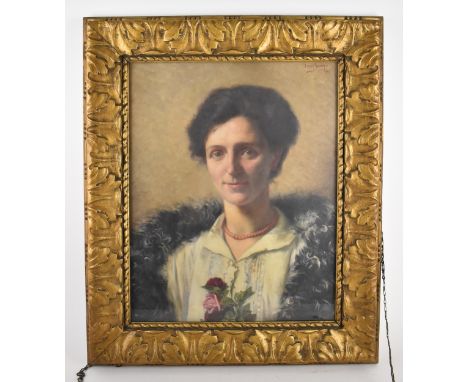 Ernest Wante (1872-1960) Belgian portrait of a lady, wearing a coral beaded necklace, fur stole and holding roses, signed 'Er