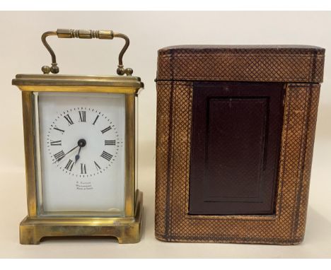 An early 20th century brass cased carriage clock, the white enamel dial having blued hands, Roman numerals and inscribed 'R.S