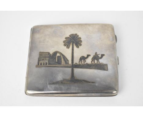 A Continental white metal cigarette case, with niello enamel Egyptian scene to the front and back, unmarked, 10.5 cm x 9 cm, 