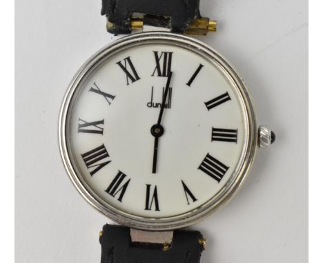 A Dunhill manual wind, wristwatch, the white enamel dial with black Roman numerals, and black baton hands, the two piece scre