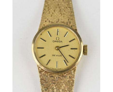 An Omega De Ville manual wind ladies 9ct gold wristwatch, circa 1971, having a gilt dial with baton markers. The calibre 620 