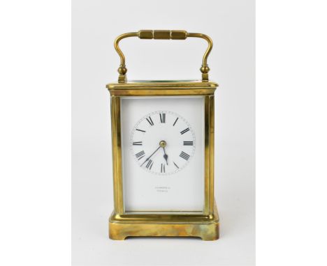 An early 20th century brass carriage clock, having a white enamel dial with Roman numerals, blued hands, inscribed 'J.A Haske