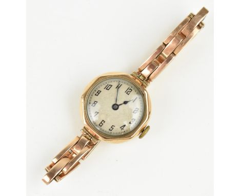 An early 20th century 9ct gold ladies, manual wind watch having a silvered dial with Arabic numerals, blued hands,  15 jewel 