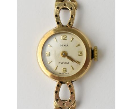 An Olma manual wind, ladies 9ct gold, 1960s wristwatch having a silvered dial with baton markers and Arabic numerals, on a 9c