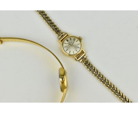 Two watches to include an Omega manual wind, ladies, gold plated wristwatch, circa 1963, having a silvered dial with baton ma