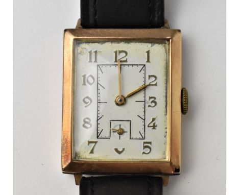 A 1940s manual wind, gents 9ct gold wristwatch having a rectangular white dial with subsidiary seconds dial, on a leather str