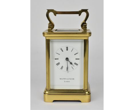 A 20th century Mappin &amp; Webb brass cased carriage clock having bevelled glass windows, white enamel dial with Roman numer